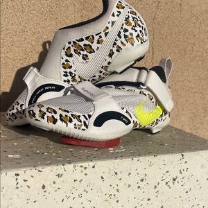 Nike women’s White Leopard-Accent cycling Sneakers with Yellow Swoosh
